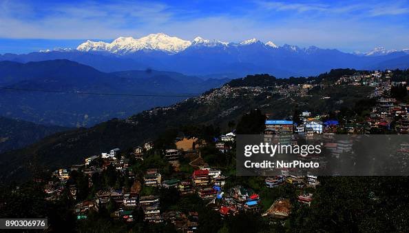 Light from a sunrise is cast on mountain Kangchenjunga near Darjeeling (bottom) on December 11, 2017. Kangchenjunga is the third highest mountain in the world with an altitude of 8,586 metres (28,169 feet) after Mount Everest and K2. The economy of the eastern Indian state of Sikkim is being buoyed by the ever increasing numbers of foreign and domestic tourists keen to view the peak which sits at the eastern end of the Himalayan Mountain Range. (Photo by S Majumder/NurPhoto via Getty Images)